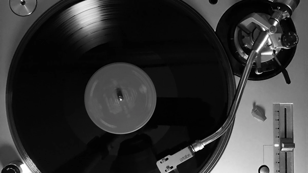 Turntable with a pitch slider next to the spinning record
